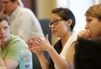 Woman talking and gesturing in a group