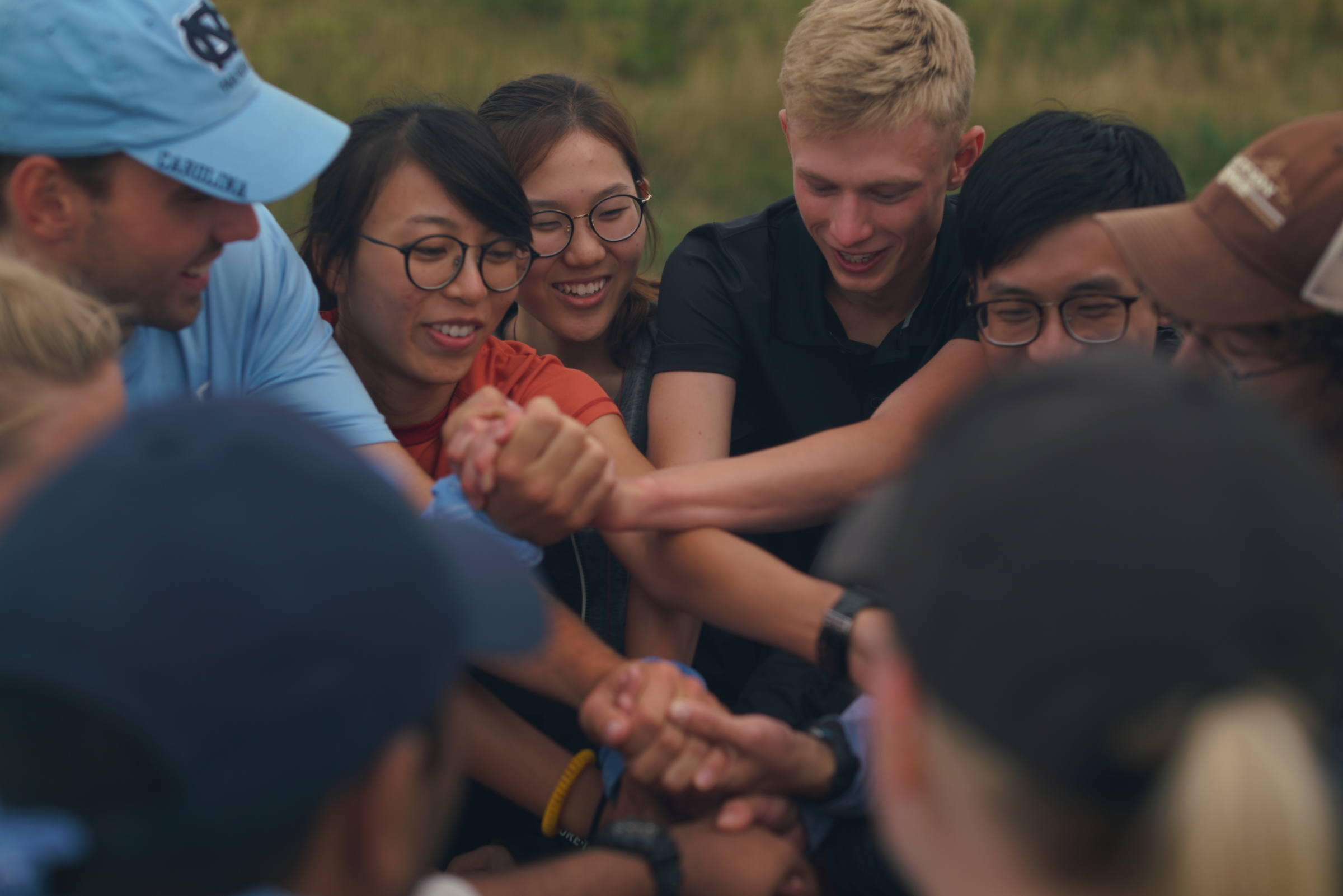 GLOBE outward bound group activity holding hands