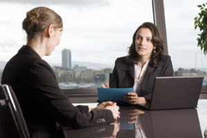 Two women sitting and talking