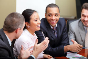 A group of people are smiling together