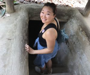 Yook entering Cu Chi Tunnels in Vietnam
