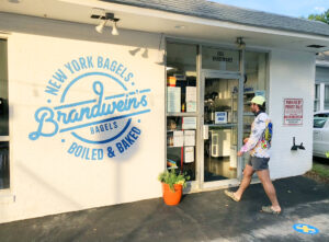 Customer walks into Brandwein's Bagels shop