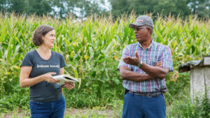 Tina Prevatte Levy of Firsthand Foods Talking to Farmer at Dwight Hall Farm