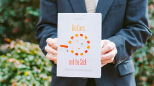 William Putsis Holding The Carrot and the Stick book at UNC Kenan Flagler