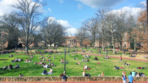 Students Sitting On Lawn At UNC Chapel Hill