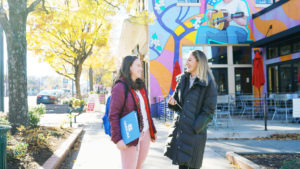 Two Women Talking On Sidewalk In Chapel Hill NC