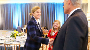 Jill Ellis Shakes Hands With Dean Doug Shackelford at UNC Kenan-Flagler 2020 Weatherspoon Leacture