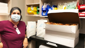 Nurse Standing With Brandweins Bagels During COVID