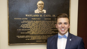 TJ Tucker Smiles Standing Next To Wayland Cato Memorial