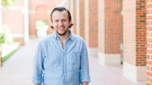 Joe Darcy Smiling Standing In Front Of UNC Kenan-Flagler McColl Building