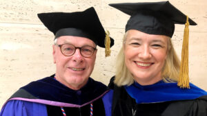 Nick Didow smiles Caludia Malhotra at 2019 UNC Kenan-Flagler Commencement