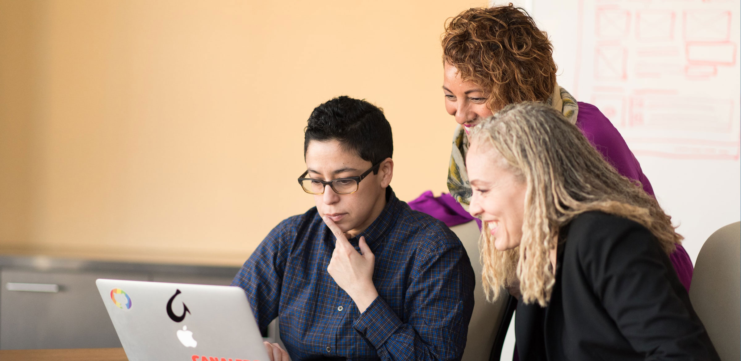women look at a computer
