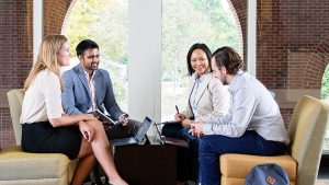 MBA students Susannah Butters, Pulkit Chahar, Joe Darcy, and Stephanie Chak have an a study session the 3rd floor  of McColl at UNC's Kenan Flagler Business school