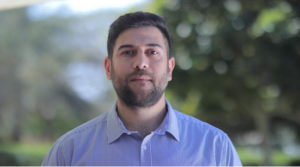 Rabih Hamid standing outside and looking at camera