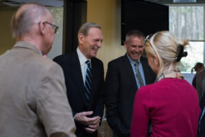 Bill McCoy laughing with staff