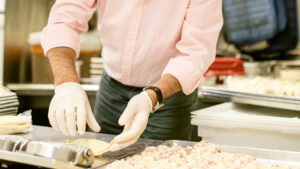 Hernan Moyano (MBA '02) makes empanadas at the Durham location of Makus Empanadas. 