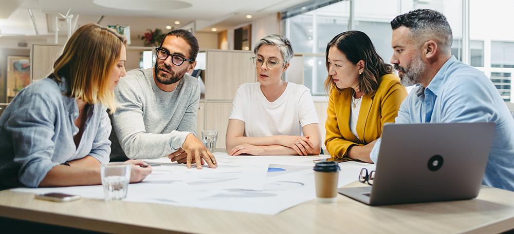 Businessperson sharing ideas during a meeting.