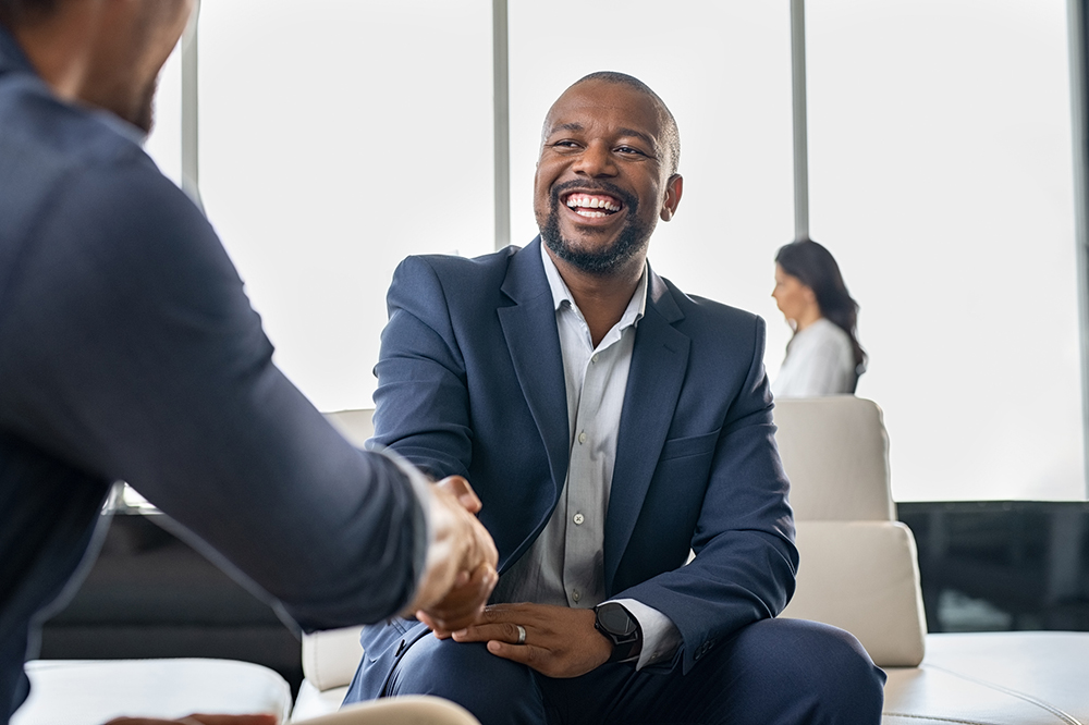 Smiling businessperson shaking hands