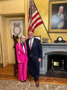 Mary Esposito (BSBA '26), left, was invited to the White House in 2025 to discuss the U.S. student loan debt crisis and meet Secretary of Education Miguel Cardona (right).