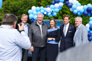 Dave Moore, Mary Margaret Frank, Lee H. Roberts and contractors pose for photo