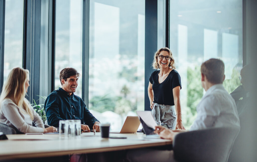 Business people having casual discussion during meeting.