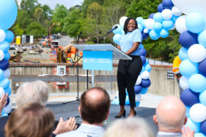 Faith Lyons (MAC '24) speaks at the Bell Hall topping off Ceremony