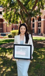 Blair Liu (PhD ’26) holds her UNC Latané Outstanding Student Teaching Award.
