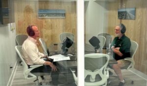 Hartzell records the podcast episode across a table with its host, Matthew Lutz.