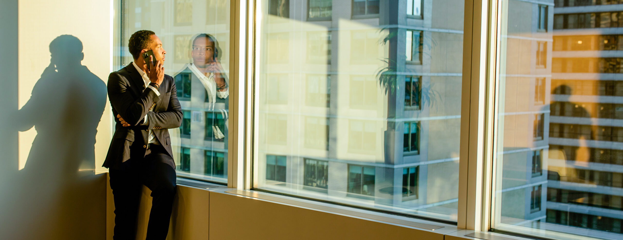 UNC Kenan-Flagler Business School alumnus at window in office in New York City