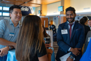 Student meeting engaging with recruiters at MBA networking event