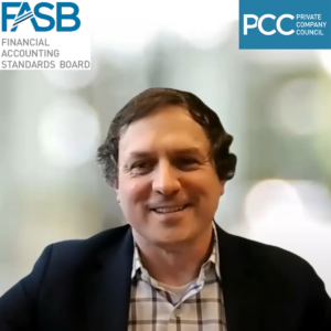 A screenshot of Brad Hendricks smiling in a video call with a blurred background.