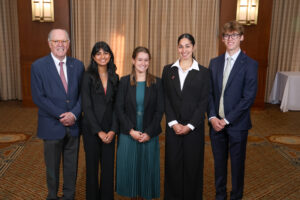 The Summer 2026 Phillips Ambassadors associated with UNC Kenan-Flagler pose for a group photo with Phillips Jr.