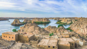 View from Bigeh. Via Eco Nubia Airbnb. Old stone buildings, rocky shores and islands on blue water.