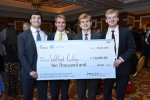 Mark Brown, Jake Bailey, Thomas Epps, and Jack Jordan from Wofford College hold large first place check in the ICSC & UNC Retail Real Estate Case Competition at ICSC Las Vegas in May.