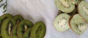 Sliced kiwi on parchment paper.