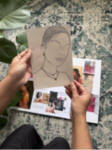 Sketch of model wearing jewelry.