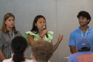 A high school student presents with her group at the Tar Heel Business Academy.