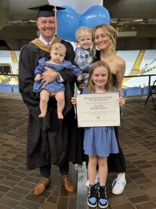 Chris Marquart (MAC '24) with his family at graduation