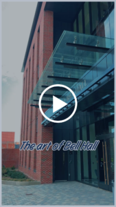 A still of a social media video about the art in Bell Hall.