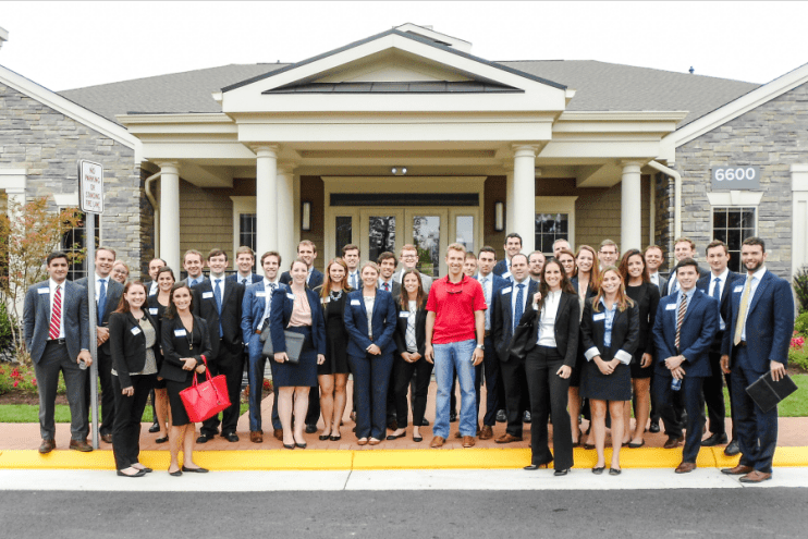 After a whirlwind tour of Avalon Falls Church, UNC Real Estate Club members join David Bookhout (MBA ’15), development manager with AvalonBay Communities, for a group picture in front of the community clubhouse.