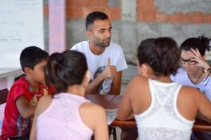 Gabriel Abreu working with students in his English classes