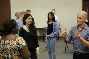 UNC Kenan-Flagler Business School professor Greg Hohn (BA '85) works with his Applied Improv students.