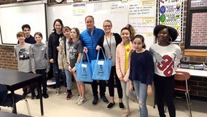 Jim Kitchen standing with students