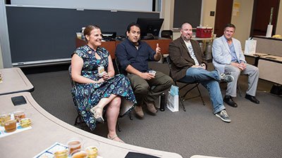 MBA graduates discussing the business of beer