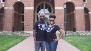 Alumni standing outside building