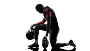 Football player kneeling