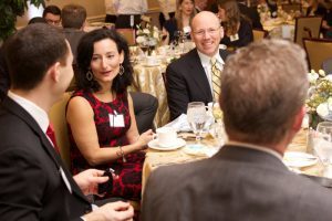 people talking at a table