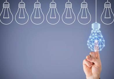 finger tapping a lightbulb