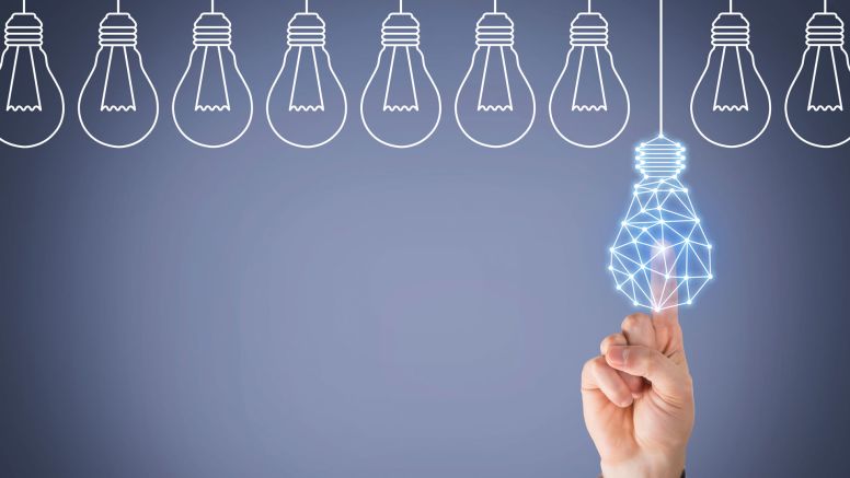 finger tapping a lightbulb