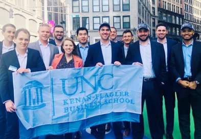 Students Holding UNC Kenan-Flagler Business School Flag in New York City